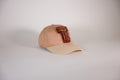 CAP 012 — casquette baseball en coton nude et écru au tuft bordeaux, tuftée main par Ninon Dechavanne, pièce unique 12/30