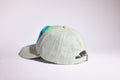 CAP 001 — casquette baseball en lin gris perle au tuft turquoise vif et écru — Tufting Studio, Paris (vue 2)